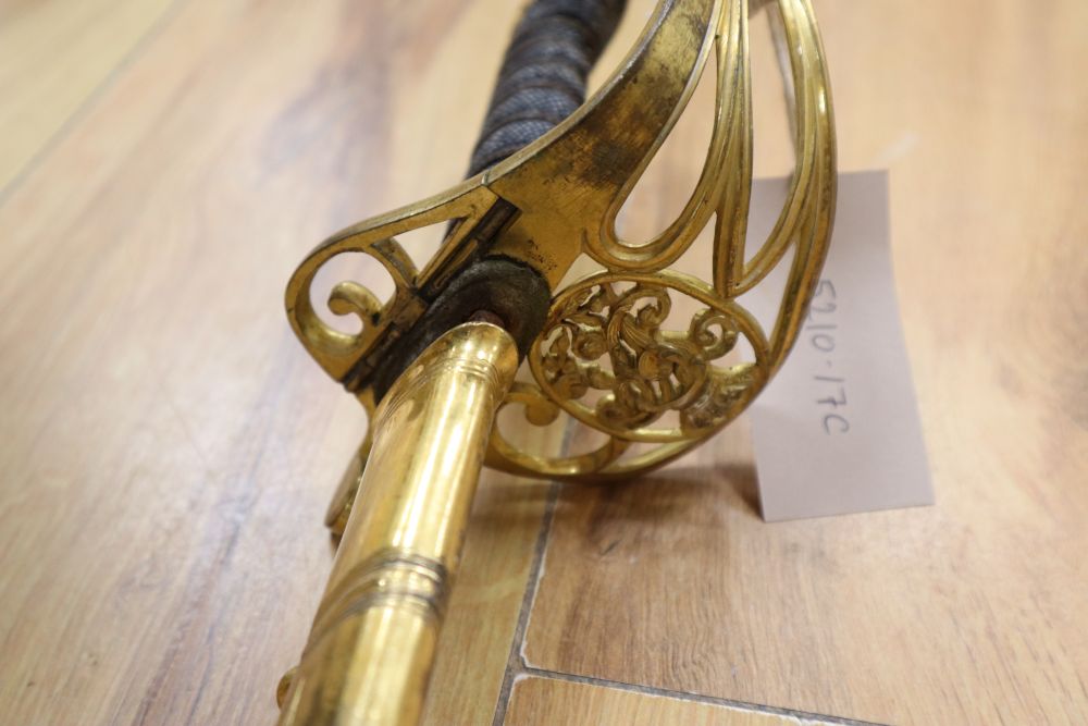 A Victorian officers sword, shagreen grip and 81cm curved, etched, single-edged blade, gilt metal scabbard, inscribed and personalised